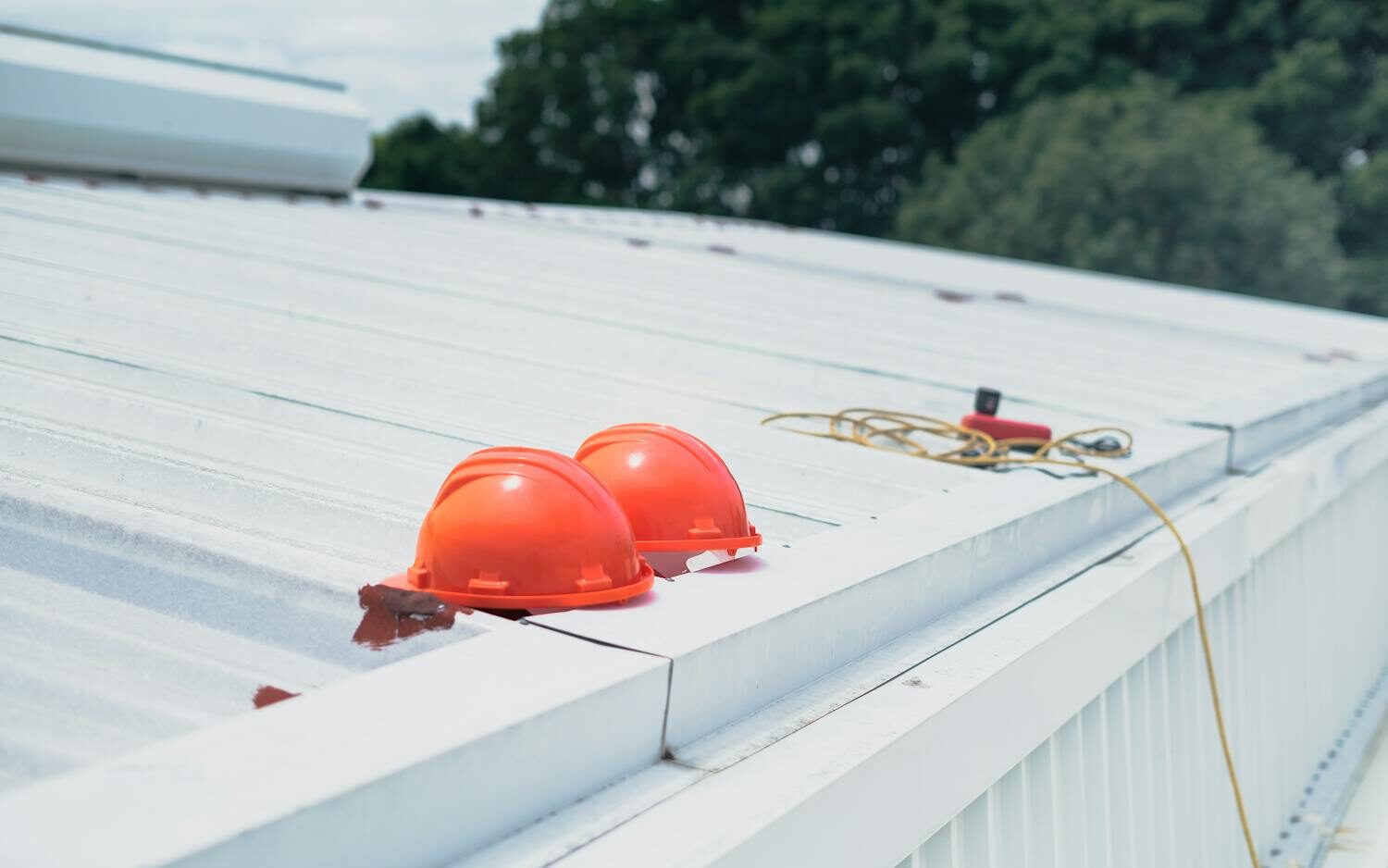 industrial park building roofing service by Coastal Roofing